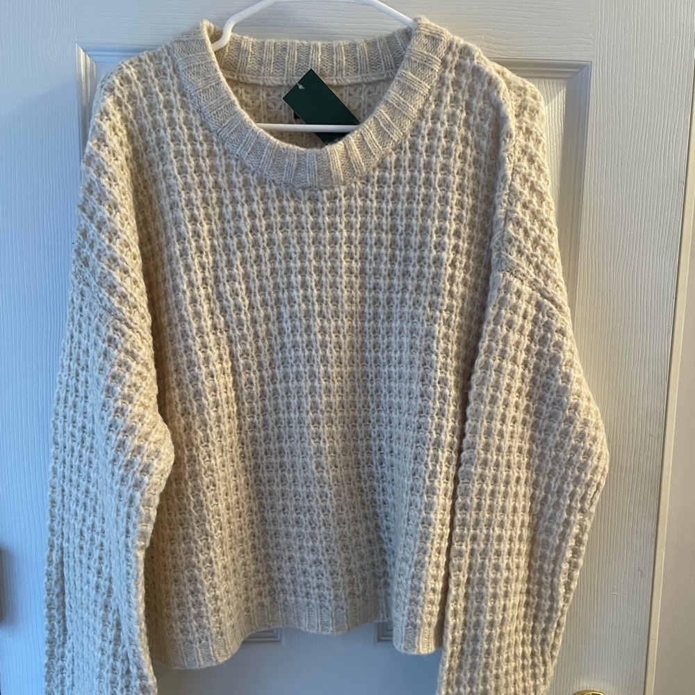 Oatmeal color sweater.Large, new with tags